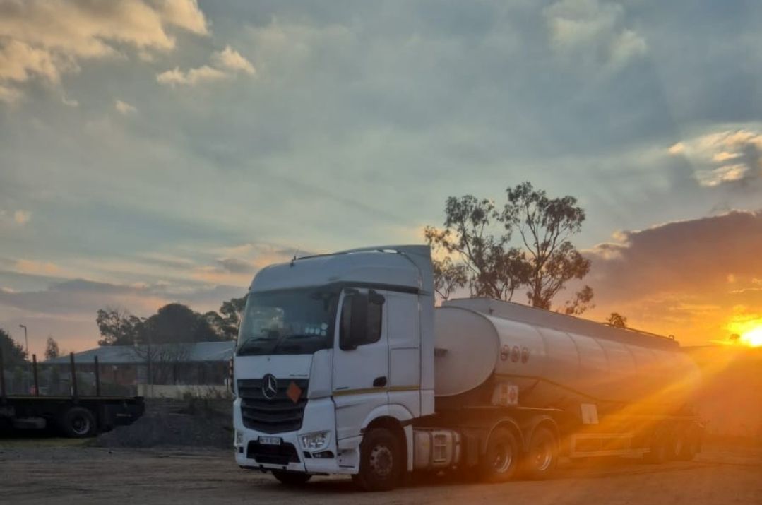 Diesel tanker truck at sunset